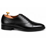  Side profile of the Marcello Semi-Brogue Oxford dress shoe in nero black leather on white background