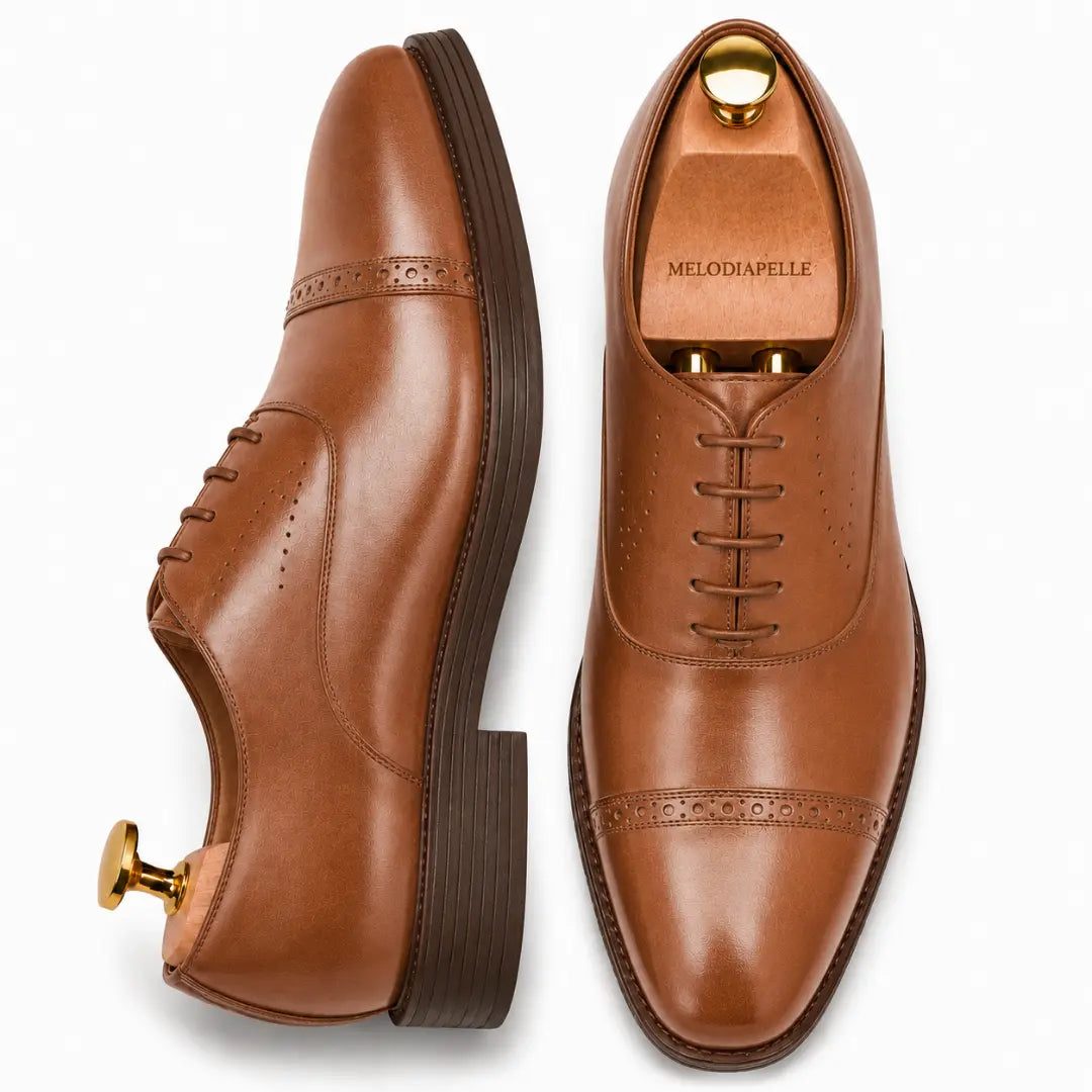 Tan leather semi-brogue Oxford, three-quarter angle showing heel and brogue detailing