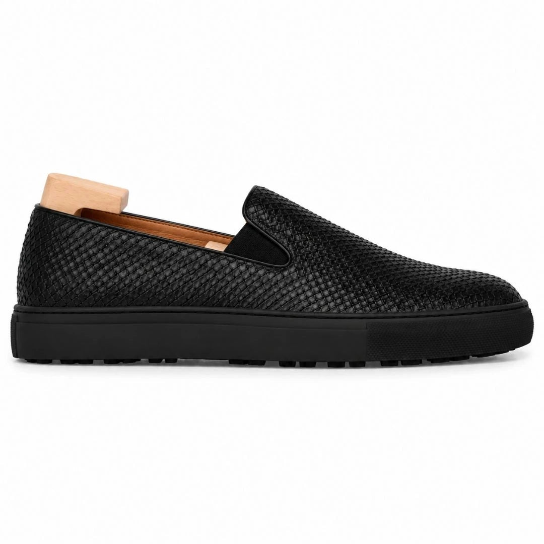Side profile of the Marengo Embossed Slip-On Sneaker in nero black leather on white background