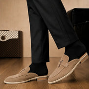 Melodiapelle Maria Mule in sand beige suede worn with trousers, on-feet shot