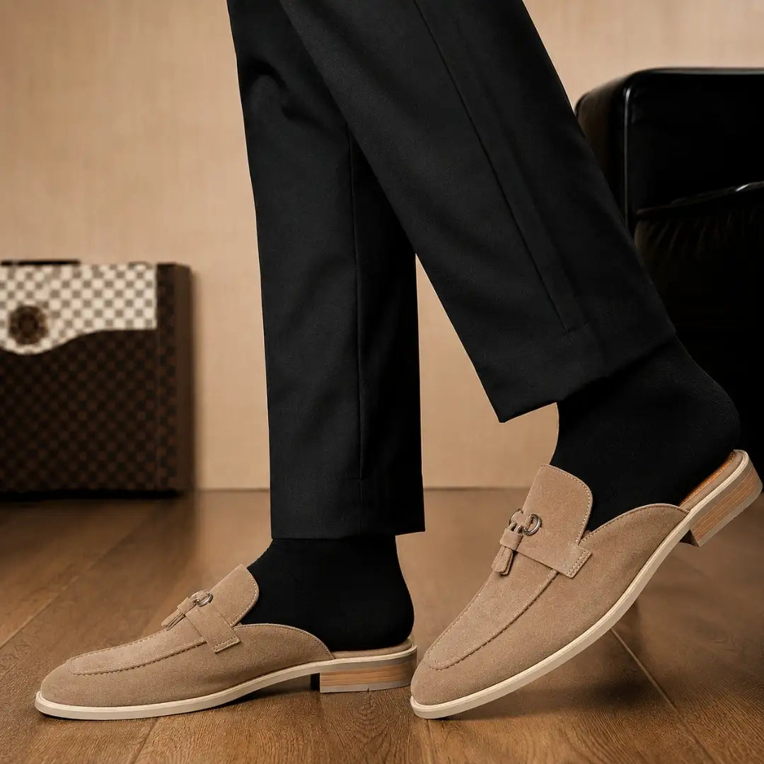 Melodiapelle Maria Mule in sand beige suede worn with trousers, on-feet shot