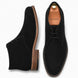 Black suede chukka boot, three-quarter angle showing heel and sole detailing