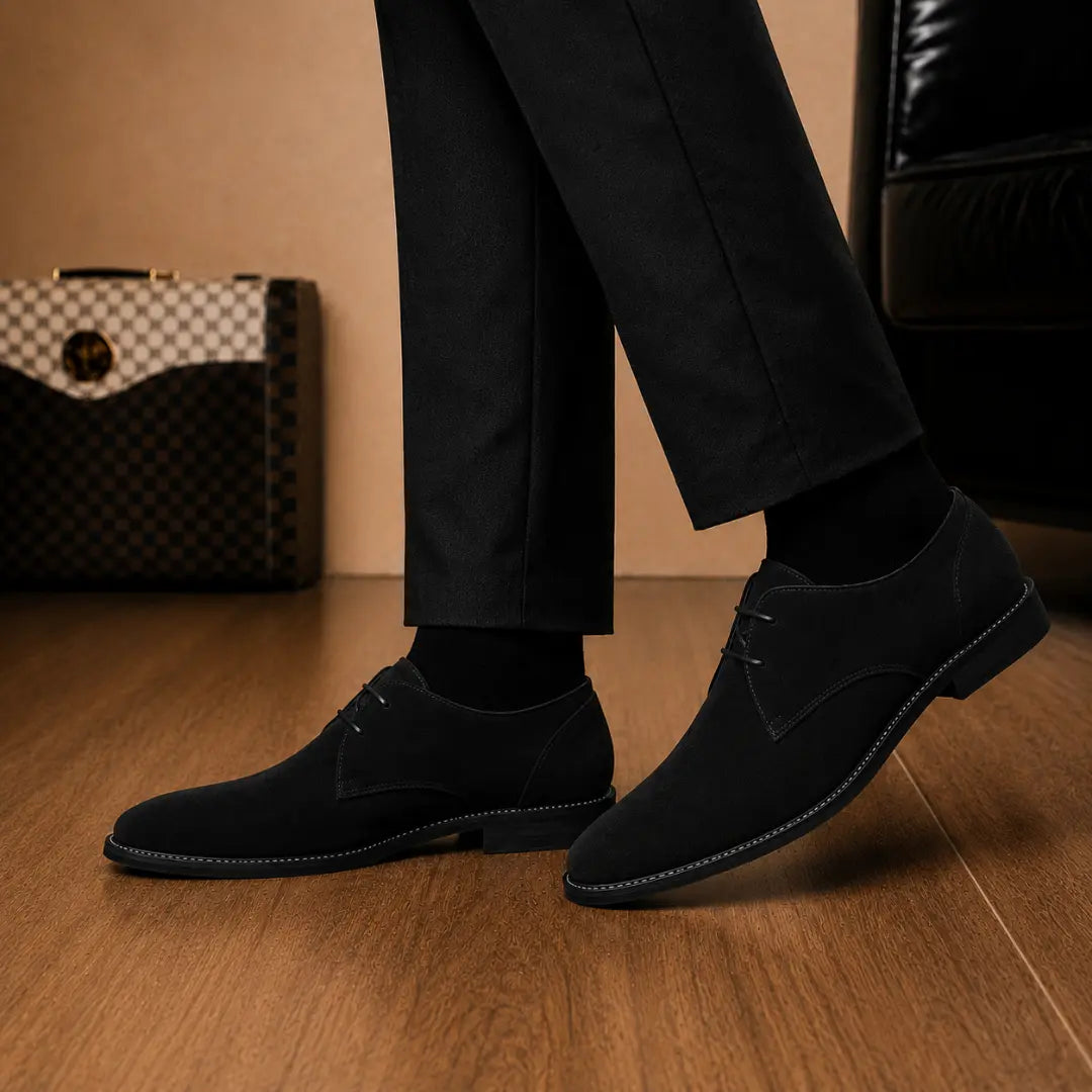 Melodiapelle Maringa Suede Chukka Boot in black suede worn with trousers, on-feet shot