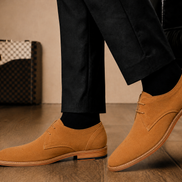 Melodiapelle Maringa Suede Chukka Boot in camel suede worn with trousers, on-feet shot