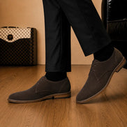 Melodiapelle Maringa Suede Chukka Boot in dark brown suede worn with trousers, on-feet shot