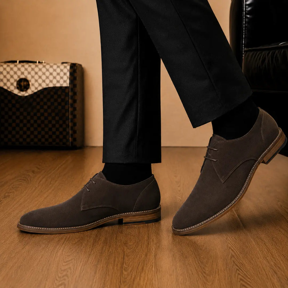 Melodiapelle Maringa Suede Chukka Boot in dark brown suede worn with trousers, on-feet shot