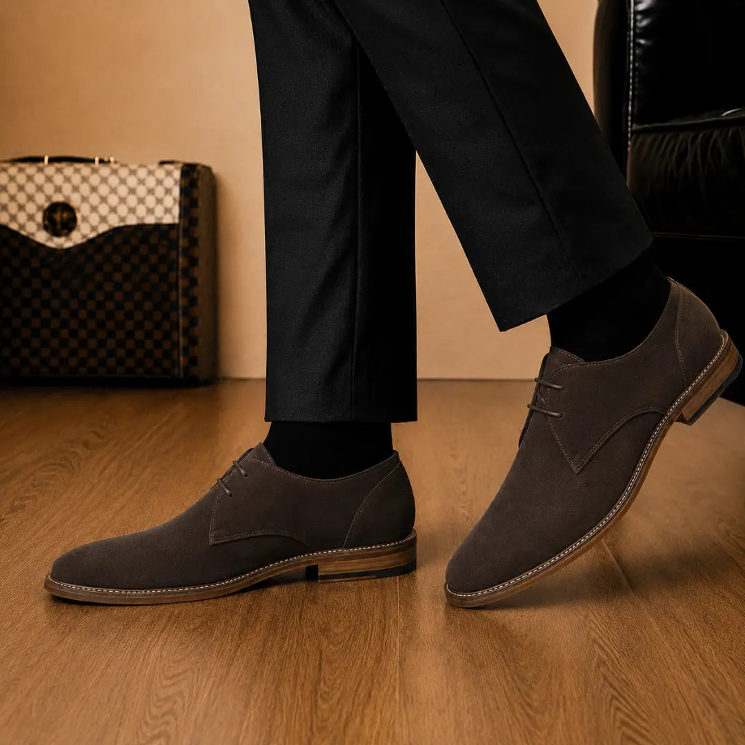 Melodiapelle Maringa Suede Chukka Boot in dark brown suede worn with trousers, on-feet shot
