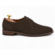 Side profile of the Maringa Suede Chukka Boot in dark brown suede on white background
