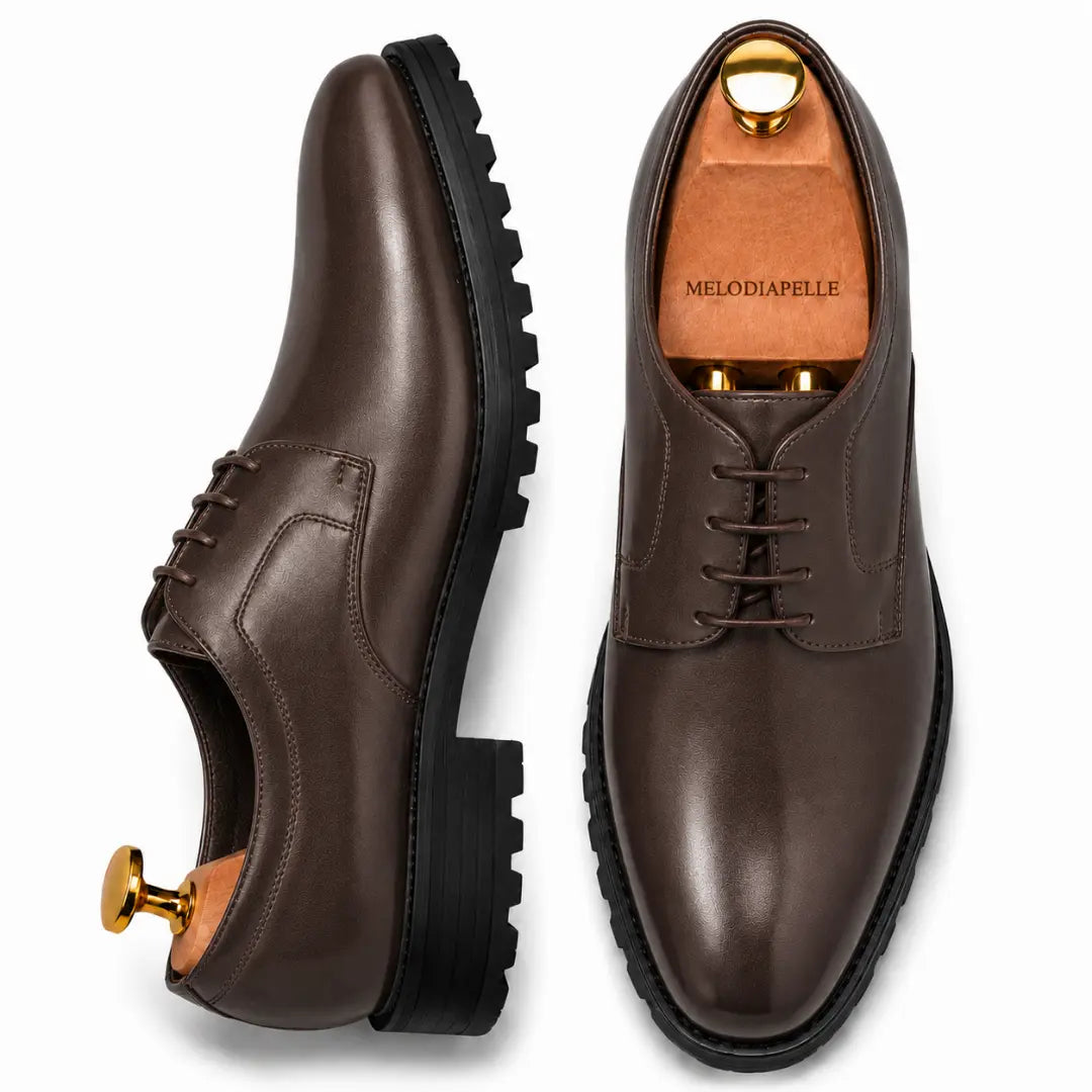 Dark brown leather plain-toe Derby, three-quarter angle showing heel and sole detailing
