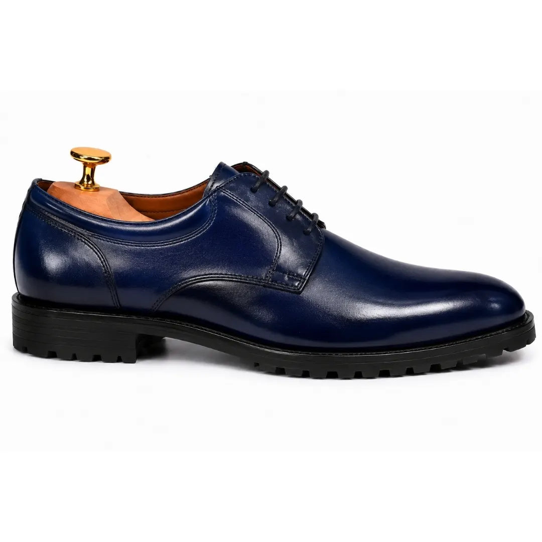 Side profile of the Marlboro Derby Shoes in navy blue leather on white background