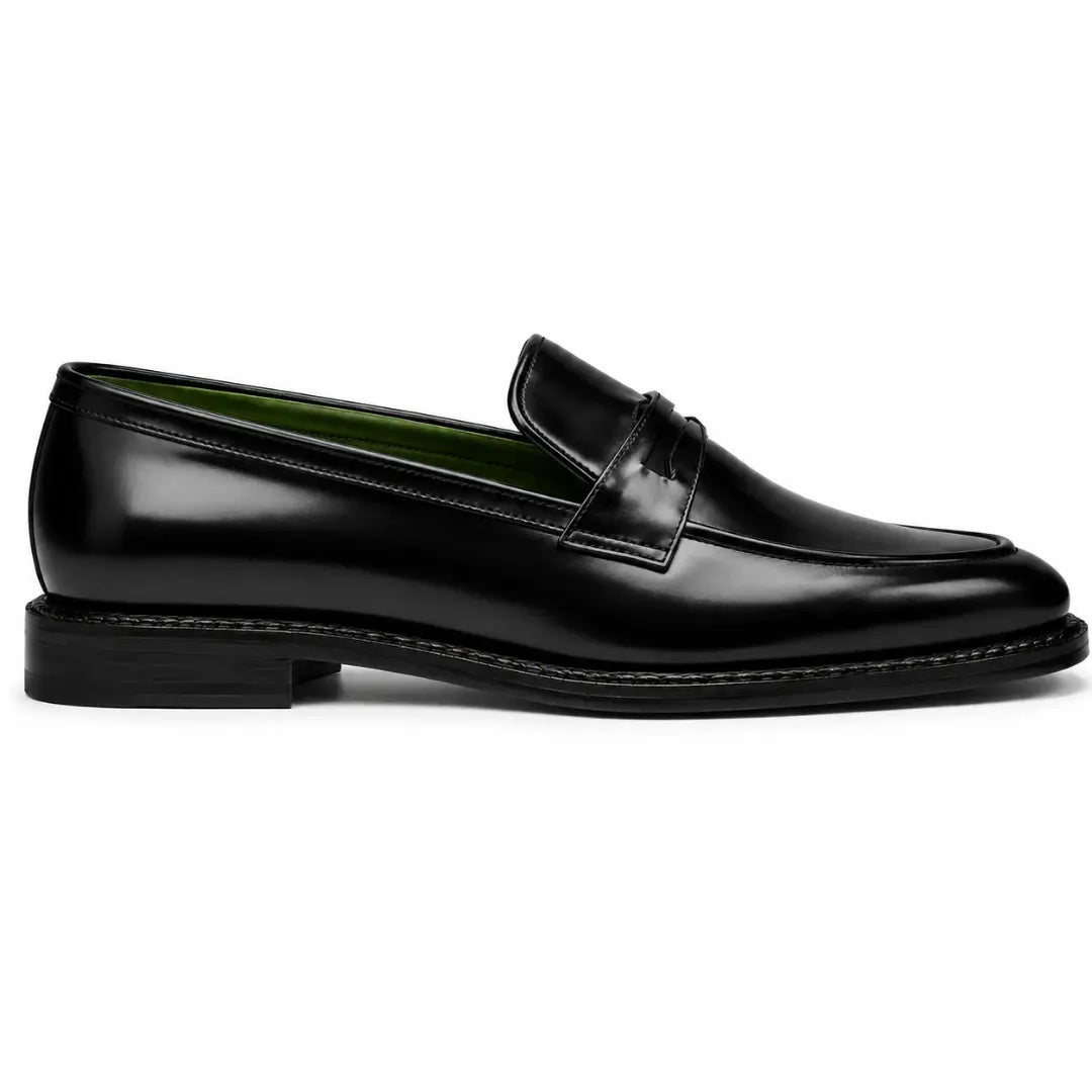Side profile of the Marquis Dress Penny Loafer in black leather on white background
