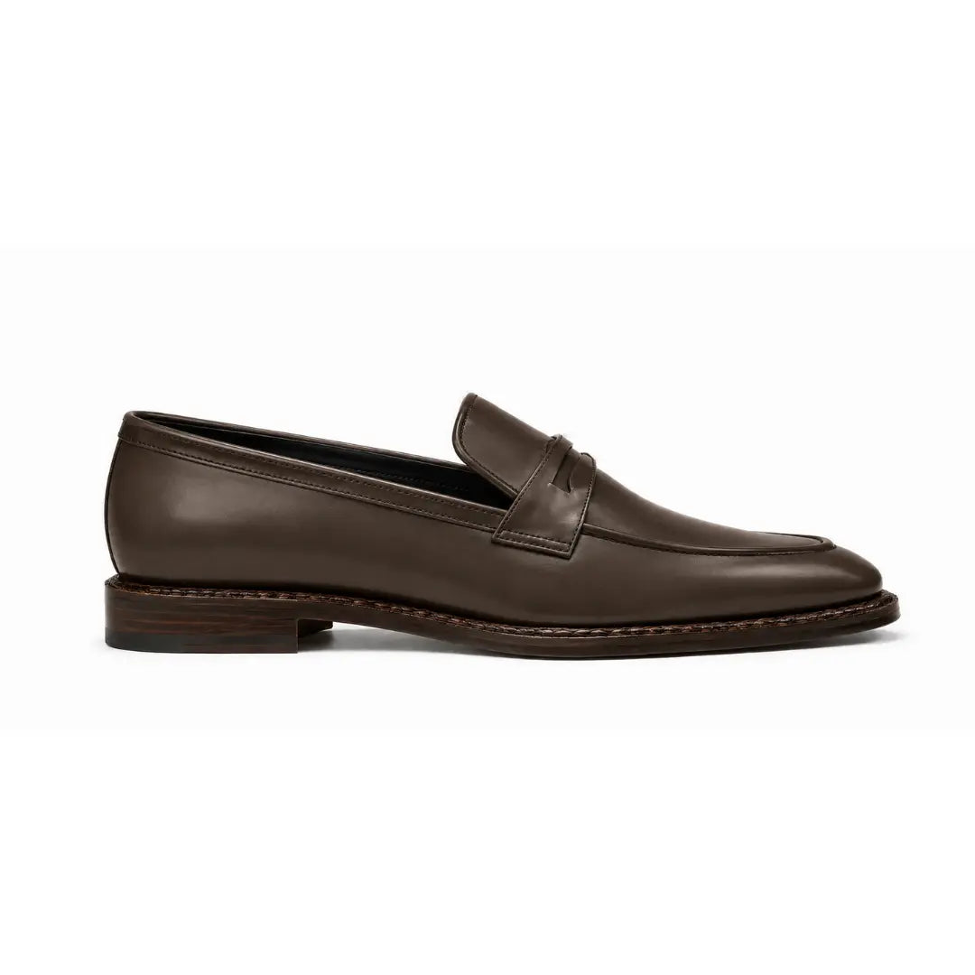 Side profile of the Marquis Dress Penny Loafer in brown leather on white background