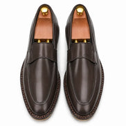 Melodiapelle Marquis Dress Penny Loafer in brown leather, pair top-down view, handcrafted in Agra