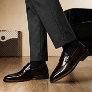 Melodiapelle Marquis Dress Penny Loafer in oxblood burgundy leather worn with formal trousers, on-feet shot