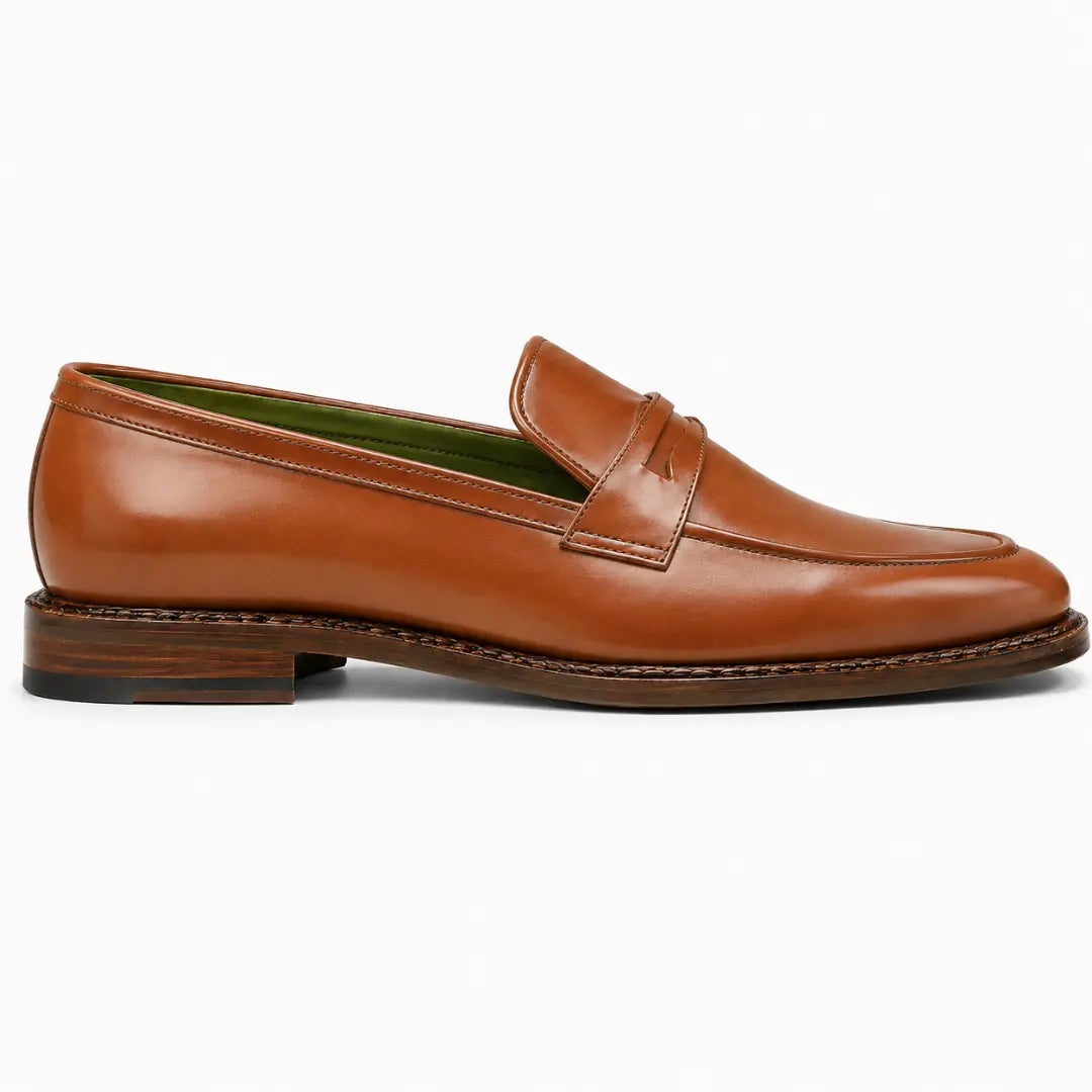 Side profile of the Marquis Dress Penny Loafer in tan leather on white background