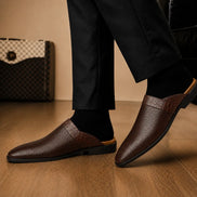 Melodiapelle Marshall Mule in dark brown leather worn with trousers, on-feet shot