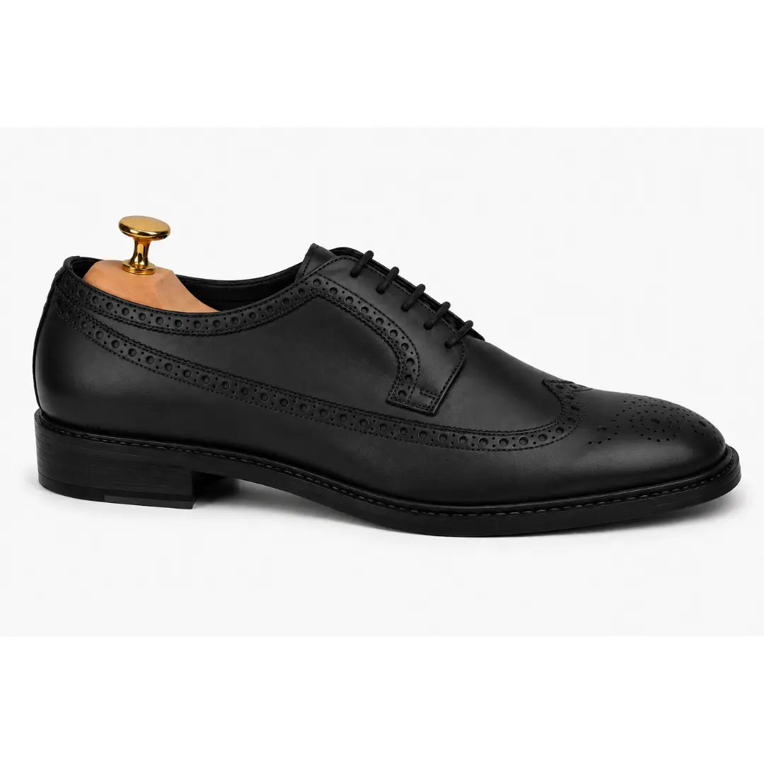 Side profile of the Marshfield Wingtip Brogue Oxford in black leather on white background