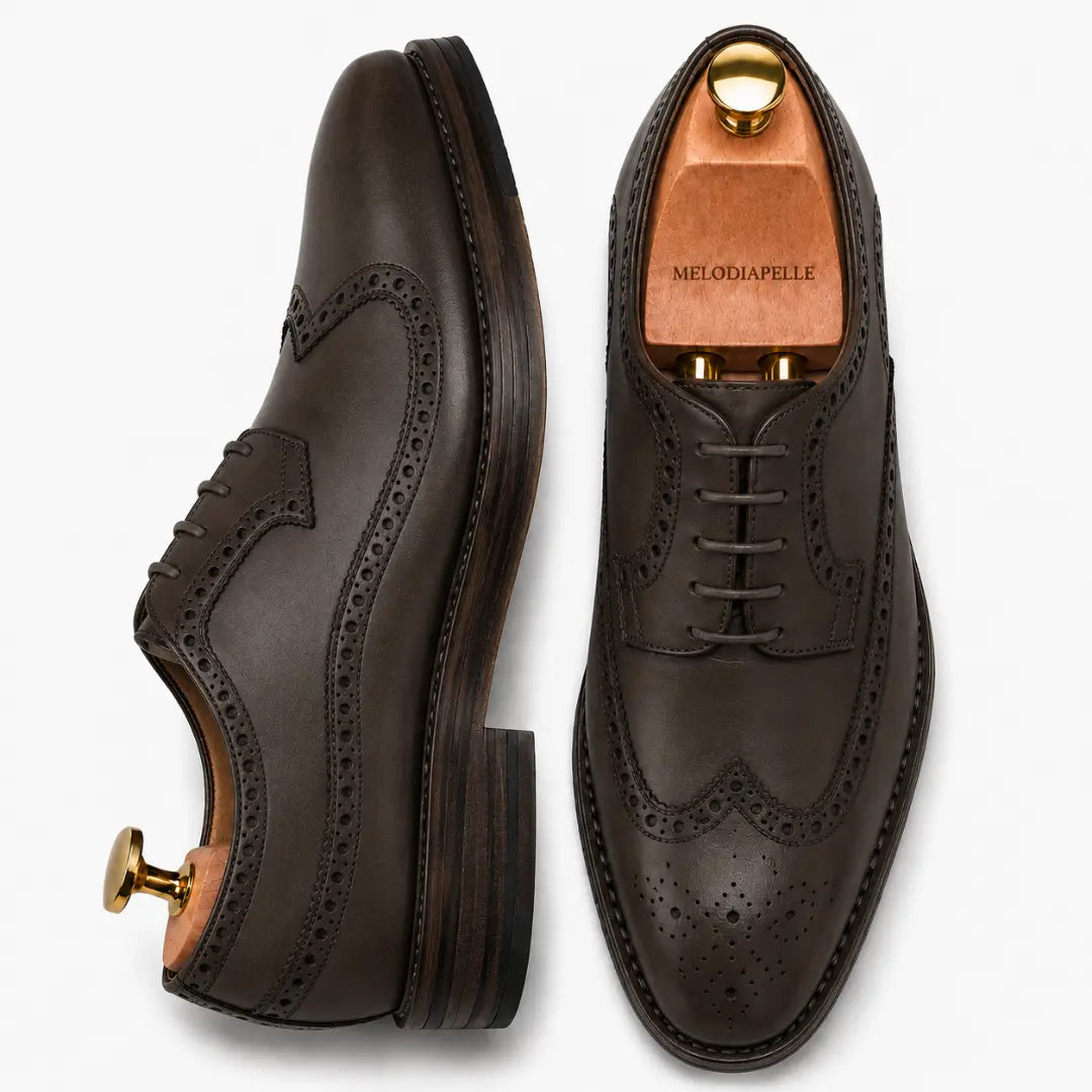 Brown leather wingtip brogue Oxford, three-quarter angle showing heel and brogue detailing