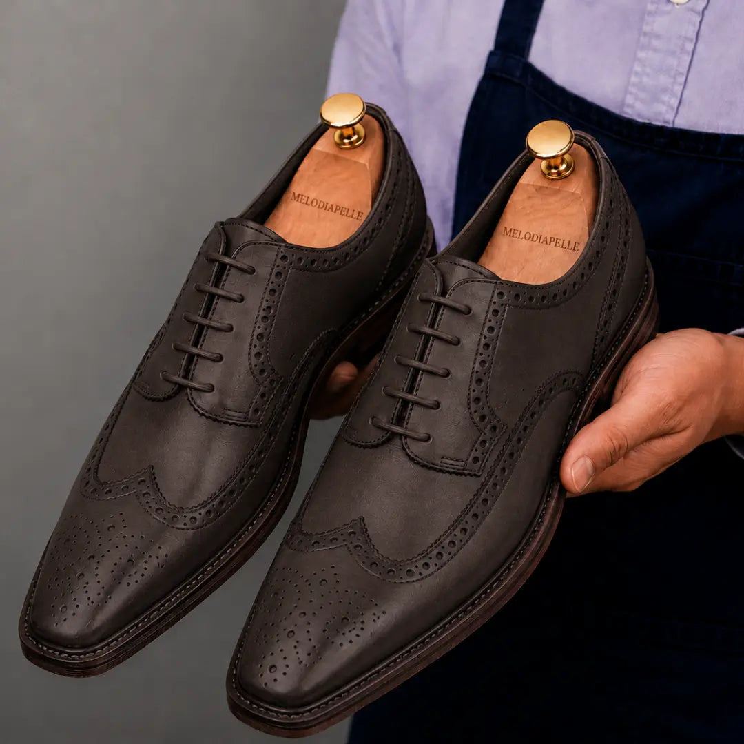 Side profile of the Marshfield Wingtip Brogue Oxford in brown leather on white background