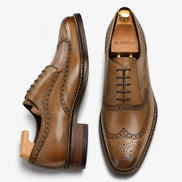 Olive khaki leather wingtip brogue Oxford, three-quarter angle showing heel and brogue detailing