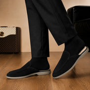 Melodiapelle Martia Mule in black suede worn with trousers, on-feet shot