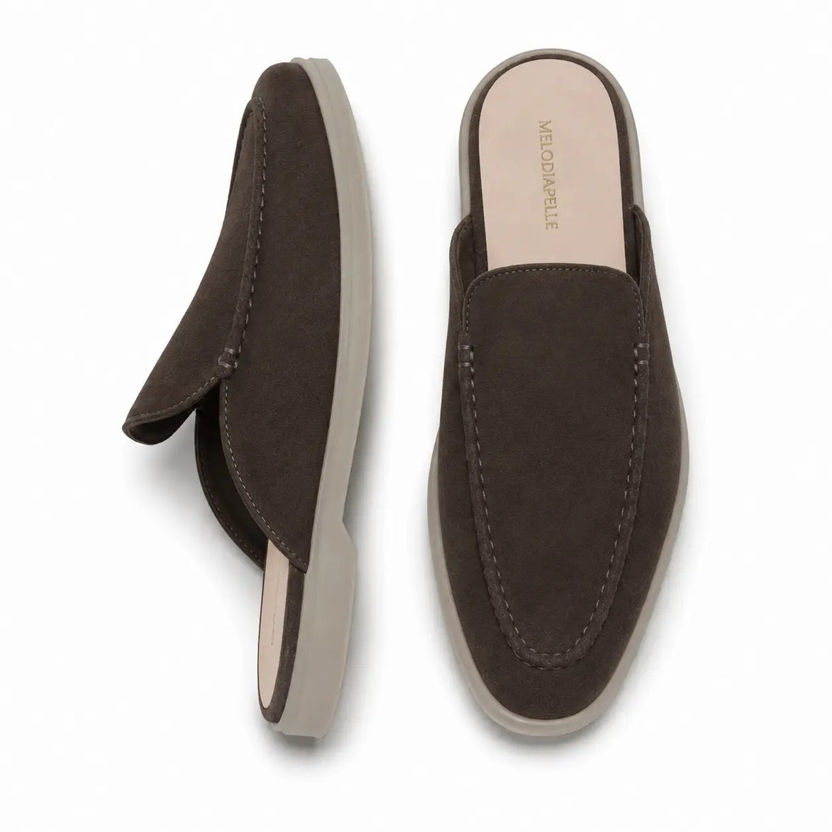 Dark brown suede backless mule loafer, three-quarter angle showing heel and sole detailing