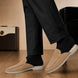 Melodiapelle Martia Mule in sand beige suede worn with trousers, on-feet shotMelodiapelle Martia Mule in sand beige suede worn with trousers, on-feet shot