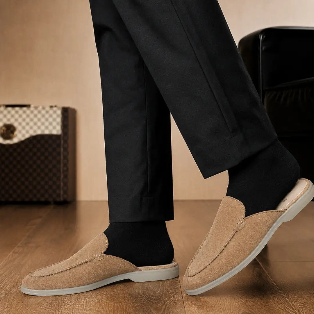 Melodiapelle Martia Mule in sand beige suede worn with trousers, on-feet shotMelodiapelle Martia Mule in sand beige suede worn with trousers, on-feet shot