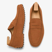 Rust tan suede penny loafer, three-quarter angle showing sole detailing