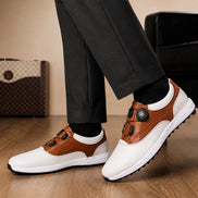 Melodiapelle Marzano BOA Golf Shoe in white and tan leather worn with trousers, on-feet shot