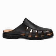 Side profile of the Mason Mule in black leather on white background