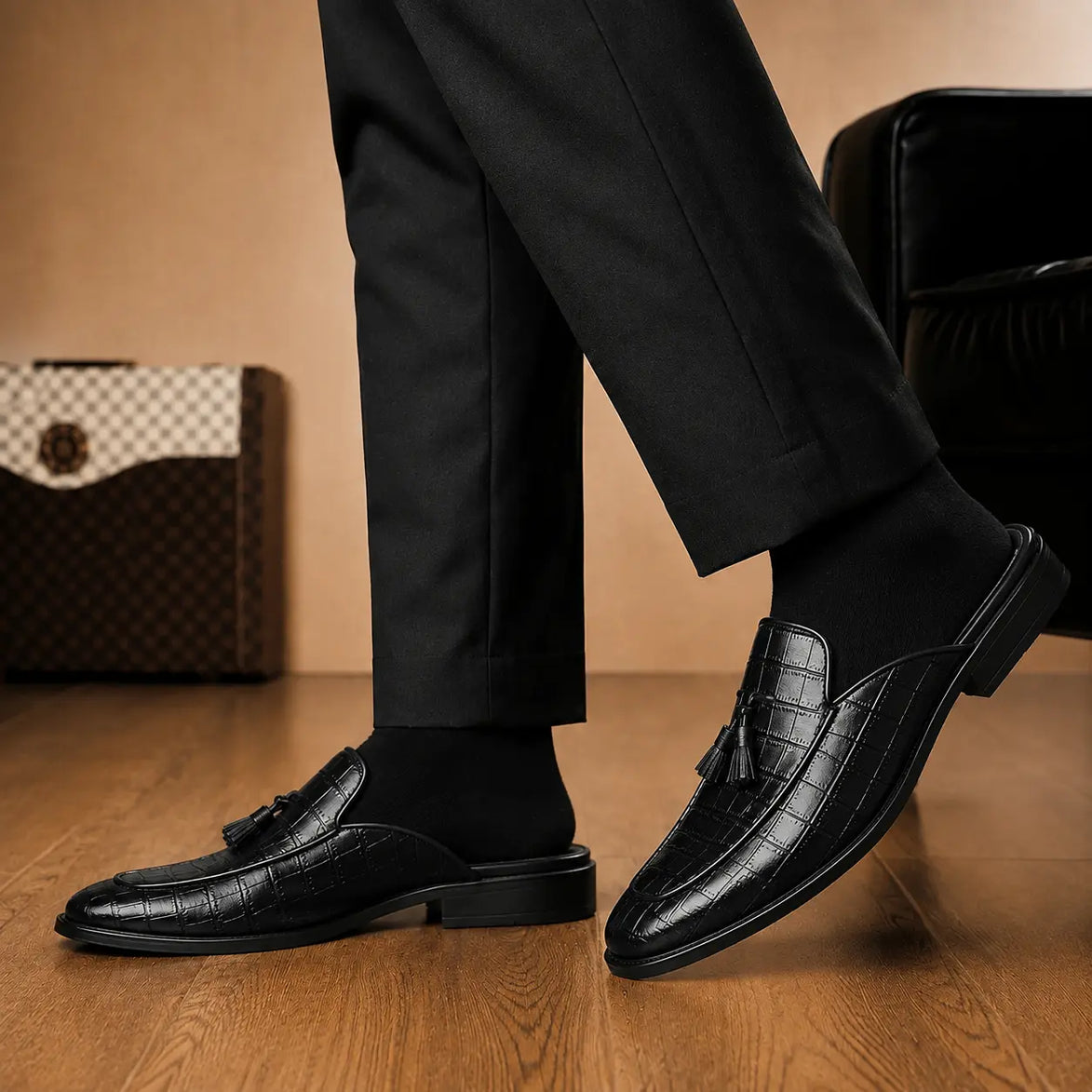 Melodiapelle Mason Mule in black croc-embossed leather worn with formal trousers, on-feet shot