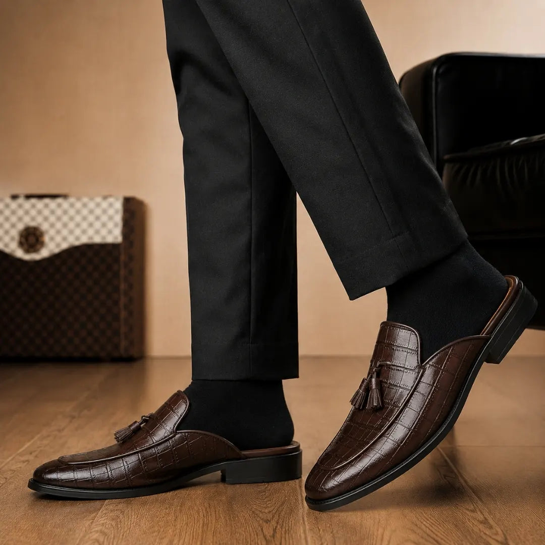 Melodiapelle Mason Mule in dark brown croc-embossed leather worn with formal trousers, on-feet shot