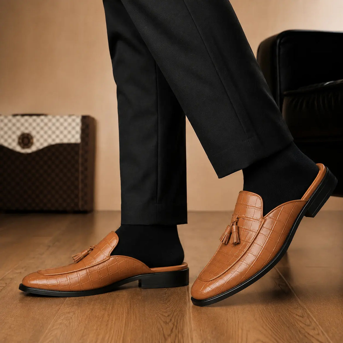 Melodiapelle Mason Mule in tan croc-embossed leather worn with formal trousers, on-feet shot