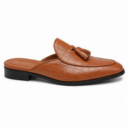 Side profile of the Mason Mule in tan croc-embossed leather on white background
