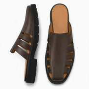 Dark brown leather caged mule, three-quarter angle showing cutout panel and sole detailing