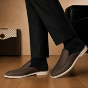 Melodiapelle Massimo Mule in dark brown leather worn with trousers, on-feet shot