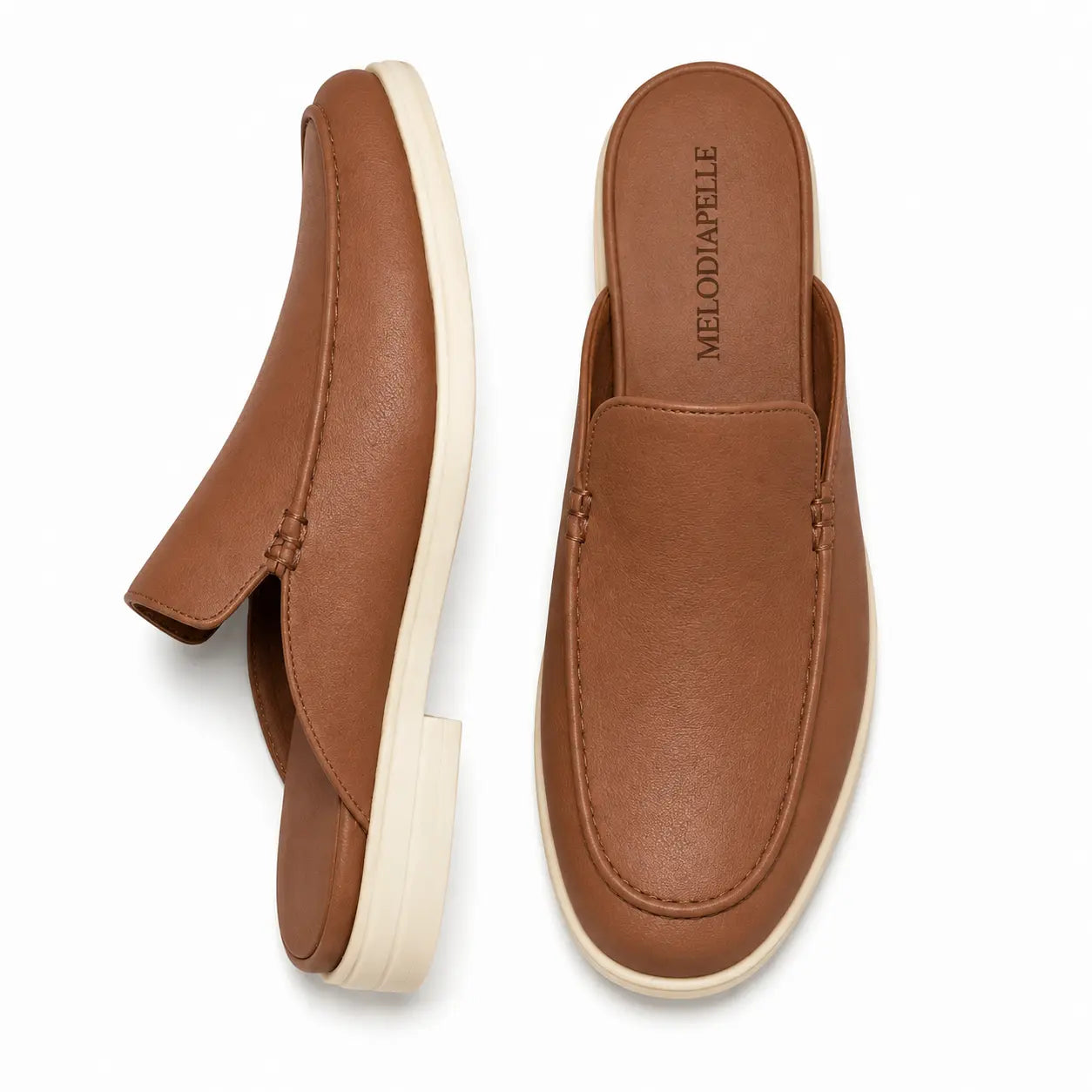 Tan leather backless mule loafer, three-quarter angle showing heel and sole detailing