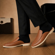 Melodiapelle Massimo Mule in tan leather worn with trousers, on-feet shot