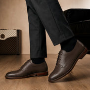 Melodiapelle Matador Apron-Toe Derby in dark brown leather worn with formal trousers, on-feet shot