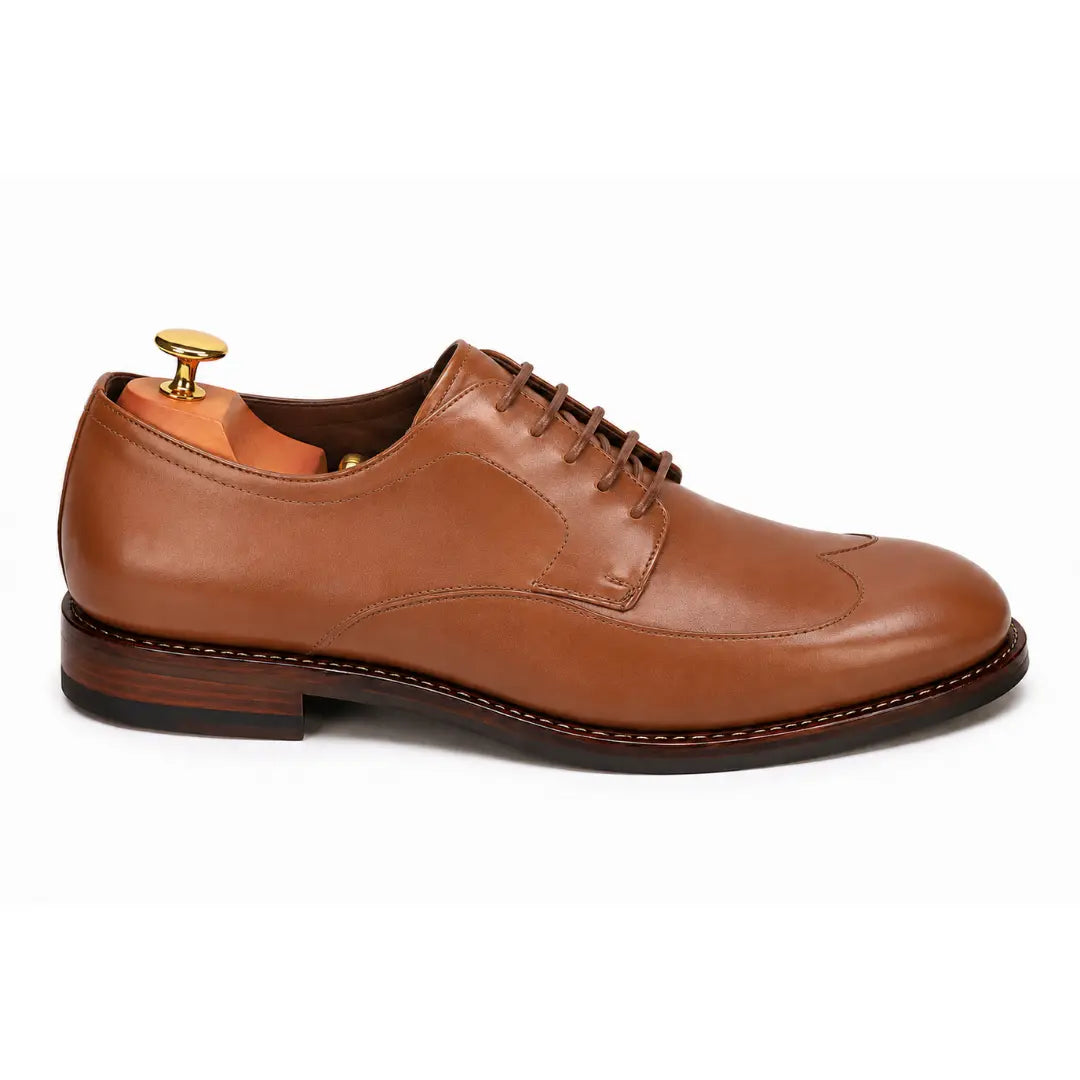 Side profile of the Matador Apron-Toe Derby in tan leather on white background