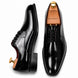 Nero black leather plain-toe Derby, three-quarter angle showing heel and glossy finish
