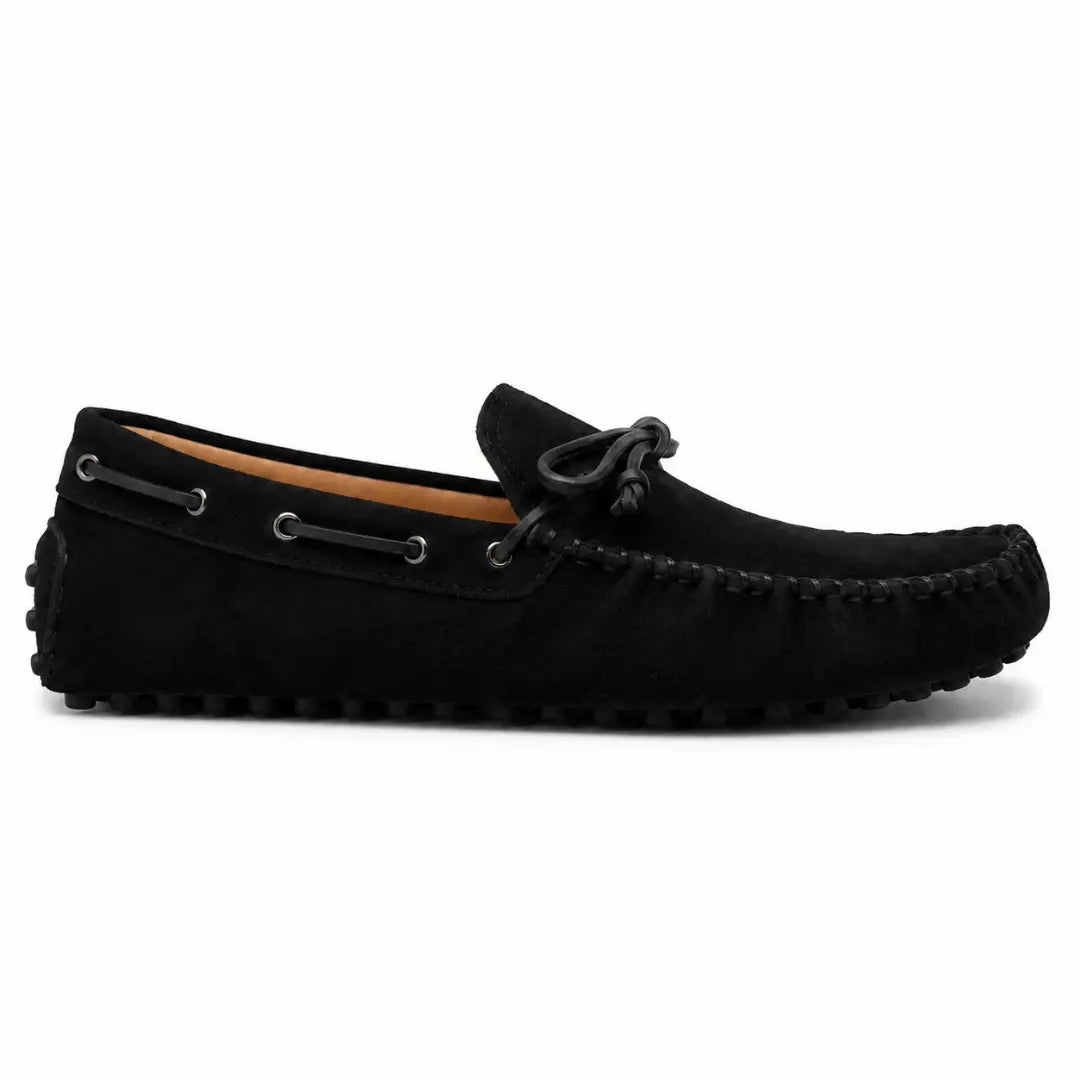 Side profile of the Mathews Loafer in black suede on white background
