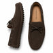 Dark brown suede driving loafer with bow lace, three-quarter angle showing sole detailing