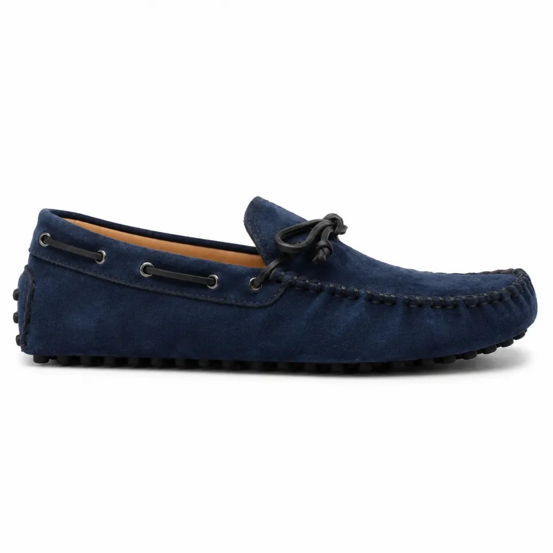 Side profile of the Mathews Loafer in navy blue suede on white background