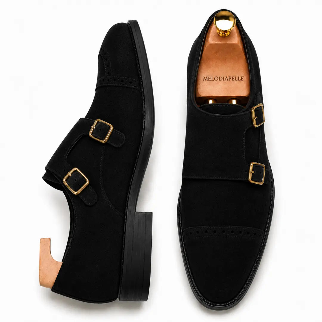 Black suede double monk strap shoe, three-quarter angle showing buckles and heel