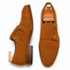 Camel suede double monk strap shoe, three-quarter angle showing buckles and heel