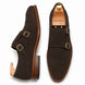 Dark brown suede double monk strap shoe, three-quarter angle showing buckles and heel
