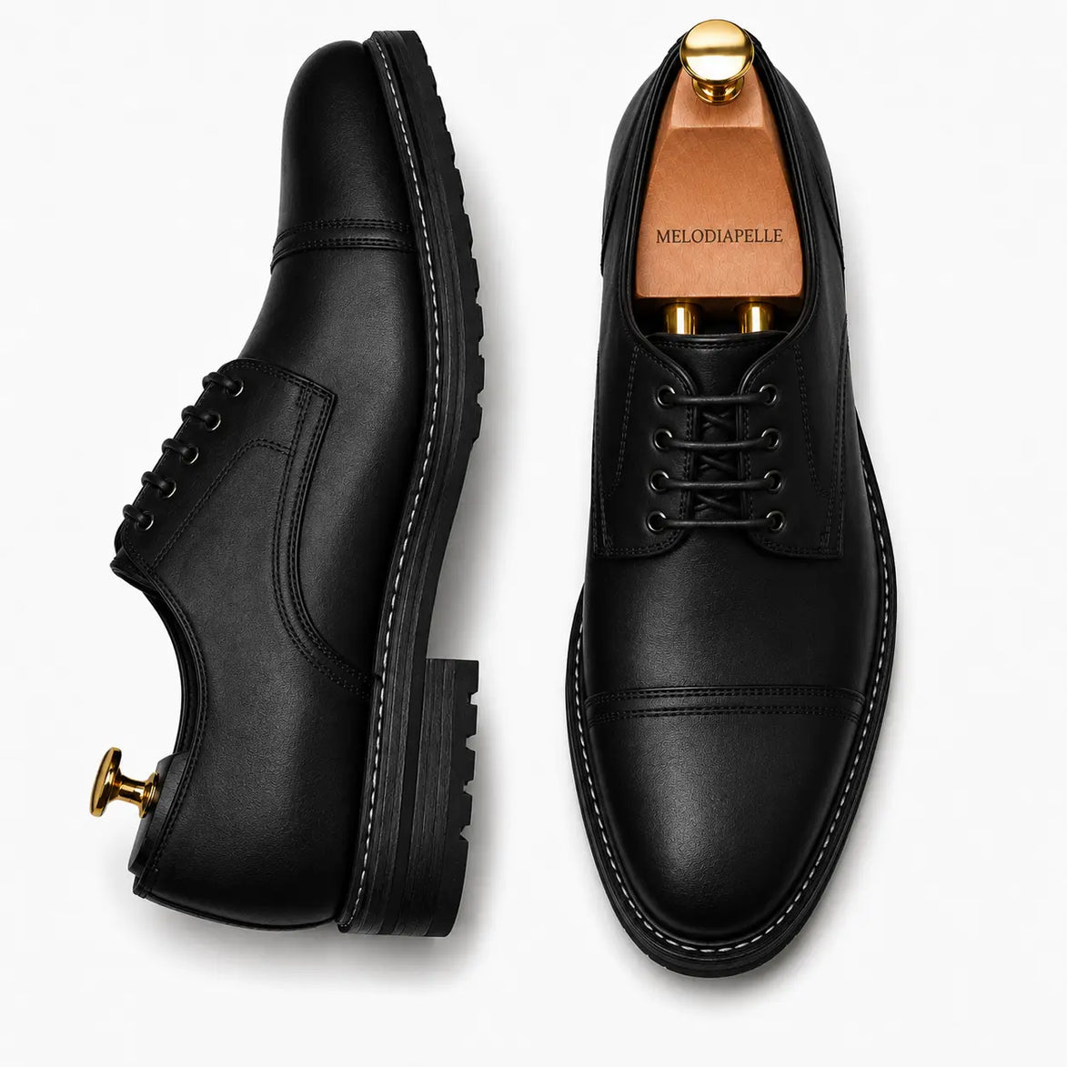 Black leather cap-toe Derby, three-quarter angle showing heel and toe detailing