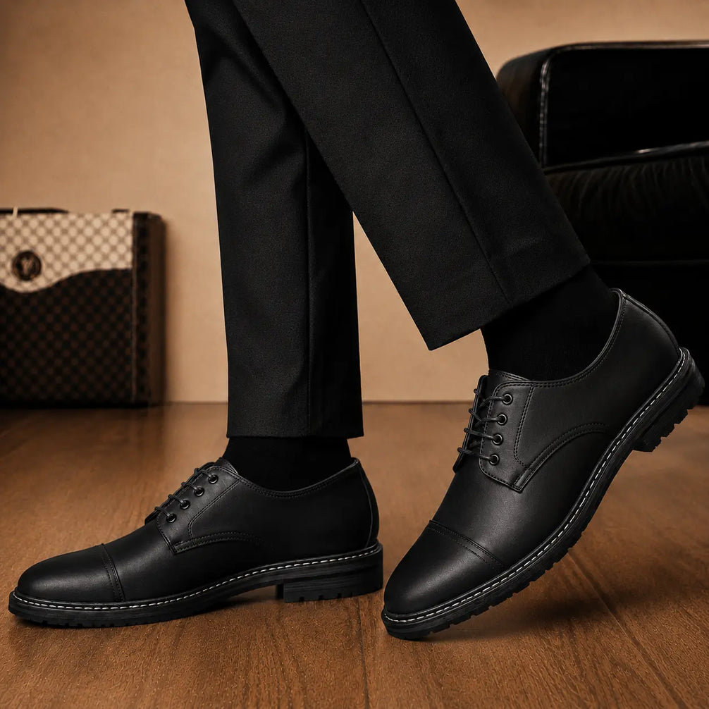 Melodiapelle Max Cap Toe Derby in black leather worn with formal trousers, on-feet shot